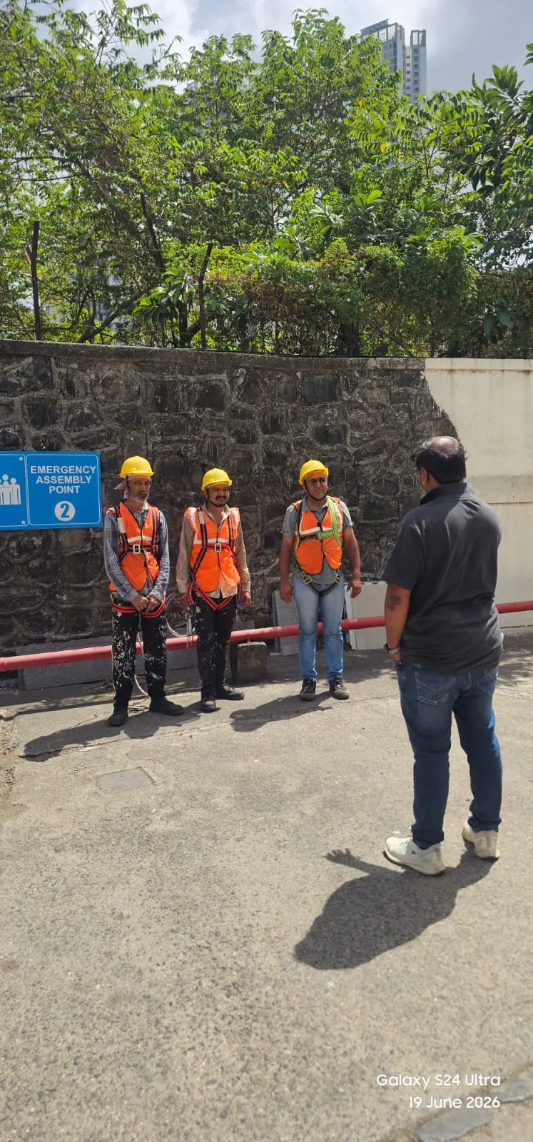 The Mahadev Waterproofing team at a site safety training session with Voltas